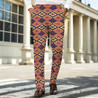Dress pants featuring the Bloomgrid in Disco Dahlia pattern with vibrant pink, orange, and cream geometric floral shapes in a retro-inspired all-over print. Statement trousers with maximalist fashion aesthetic, mod inspired style, indie streetwear, expressive queer friendly fashion, colorful geometric artwork, artsy alternative clothing, retro resort vibe, and bold patterned pants perfect for concerts, festivals, nightlife, creative workwear, parties, and everyday alternative fashion.